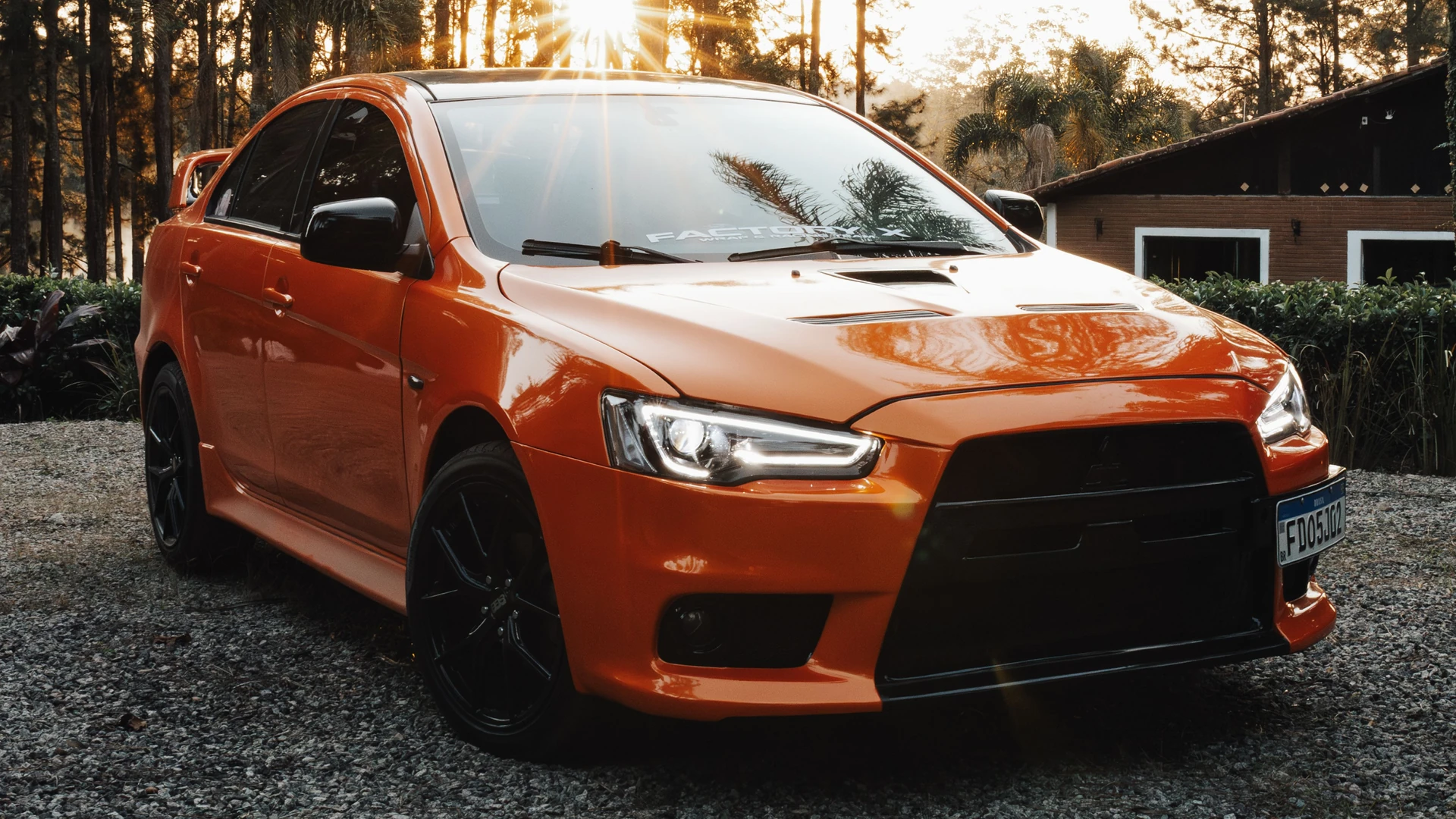 Original photo of an orange car before background removal